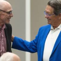 Jim Brooks smiling and greeting other event attendee